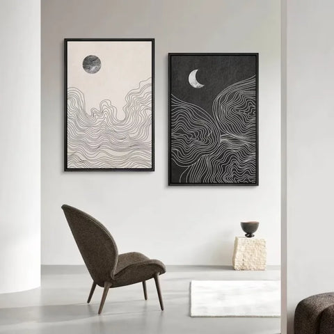 Night and Day art prints framed on a wall in a plain room