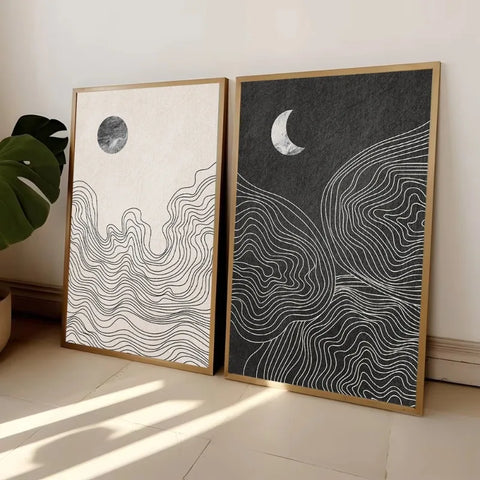 Night and Day art prints, a pair of moon and wave designs on a wooden floor