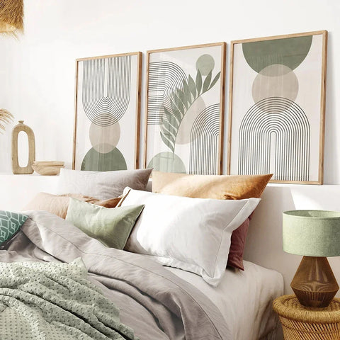 Nordic geometric leaf print hung above a bed with a bedside lamp