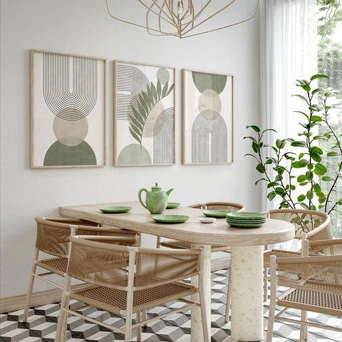 Nordic geometric leaf prints above a wooden dining table and chairs