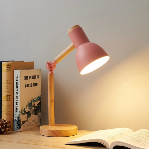 Nordic wooden desk lamp in pink, with an adjustable wooden arm