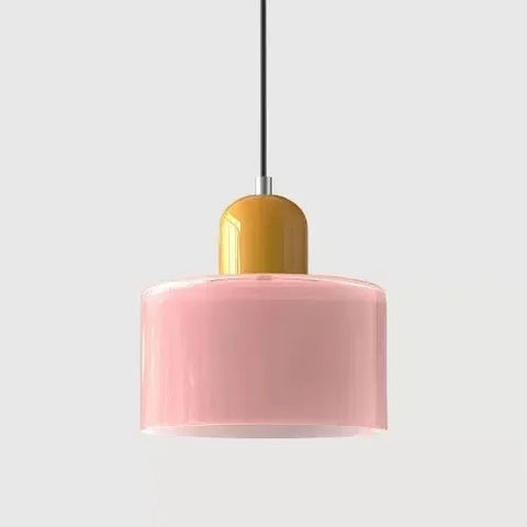 Pink glass pendant light with a mustard cap