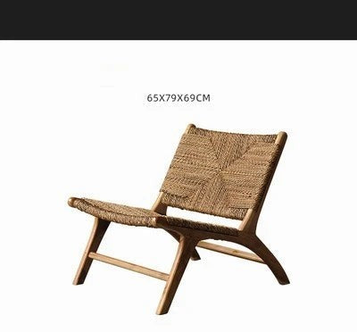 Woven rattan lounge chair shown with its measurements