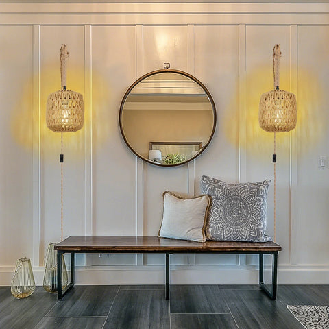 Rattan wall lamps in a hallway above a bench