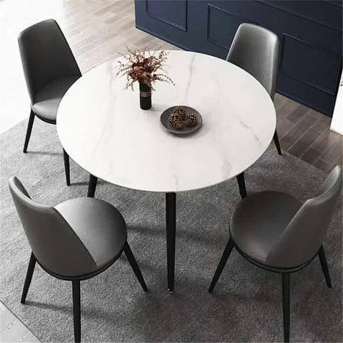 Round white marble dining table, close view of the polished stone top