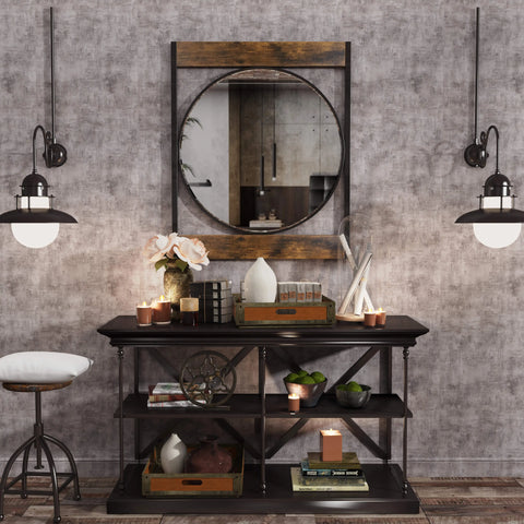 Square-framed round mirror above a console table in a hallway