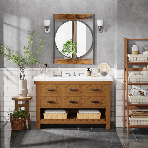Square-framed round mirror hung above a wooden sideboard