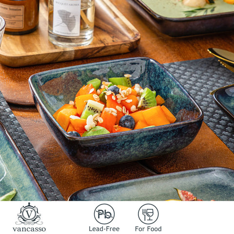 Deep green square stoneware bowl filled with salad