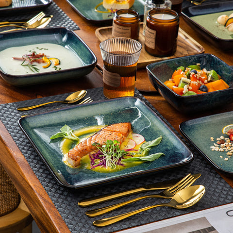 Square green stoneware plates set with gold cutlery