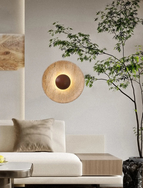 Stone and wood wall light in a living room beside a tree