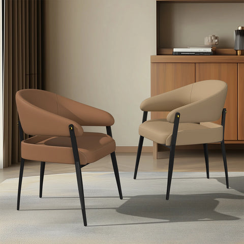 Pair of upholstered dining chairs in reddish brown microfibre leather at a dining table