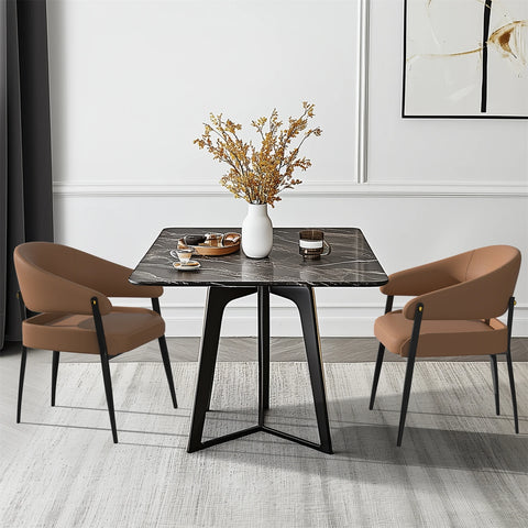 Two upholstered dining chairs at a small square table