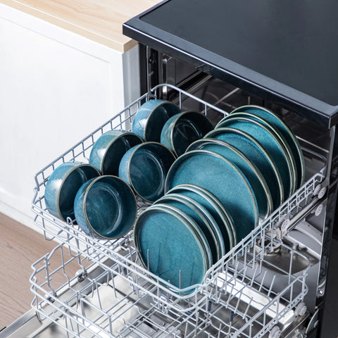 Vertical edge blue dinner set loaded into a dishwasher rack