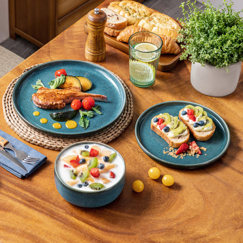 Vertical edge blue plates with a meal on a wooden table