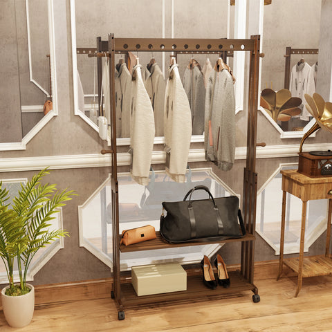 Walnut bamboo clothes stand hung with coats and bags