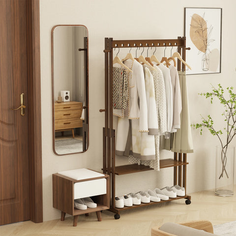 Walnut bamboo clothes stand beside a mirror in a bedroom
