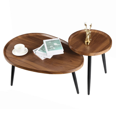 Walnut nesting coffee tables styled with a cup and book
