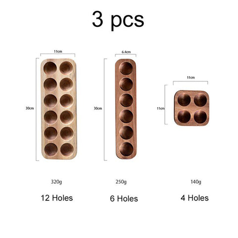 The three wooden egg tray sizes: twelve, six and four holes
