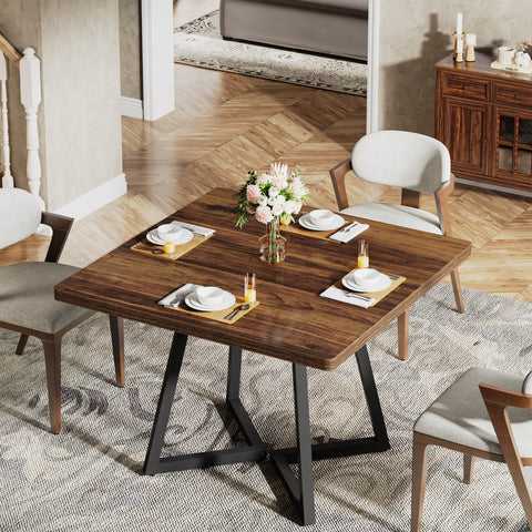 Brown wood dining table set with plates and glassware