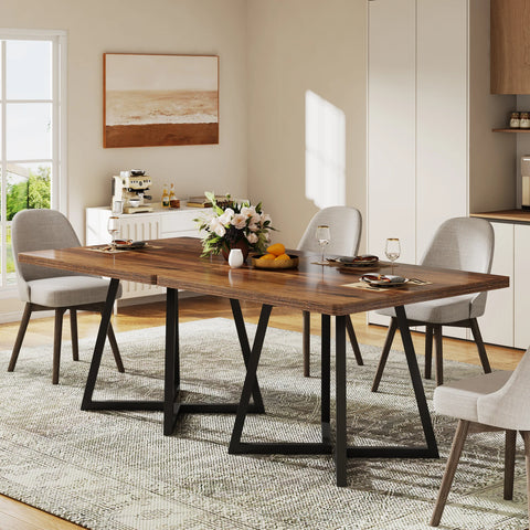 Brown wood dining table with chairs beside a window