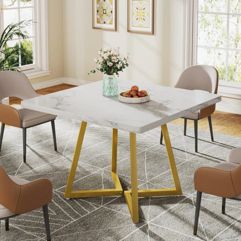 White marble dining table with gold crossed legs