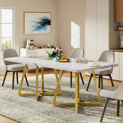 White marble dining table with gold legs in a bright dining room