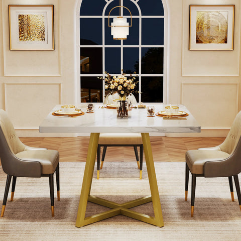 White marble dining table with gold legs laid for a meal