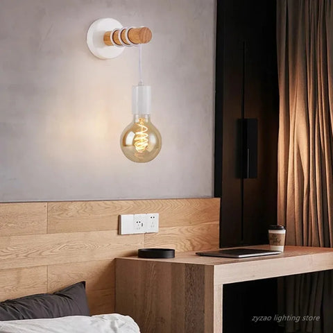 Wooden bead wall sconce above a bed