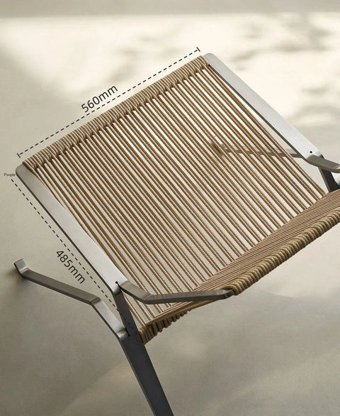 Woven cord lounge chair seen from above, showing the seat weave