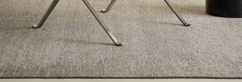 Woven cord lounge chair on a plain background