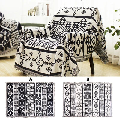 Monochrome Aztec woven throw over two chairs, with both sides shown flat