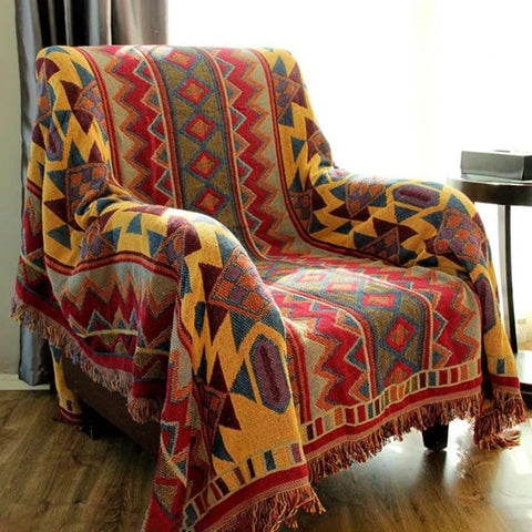 Rust Aztec woven cotton linen throw draped over an armchair