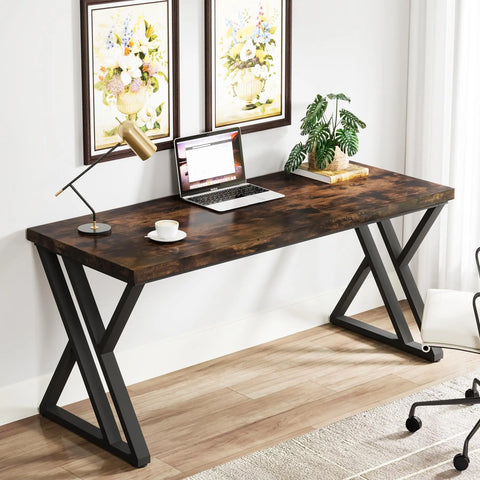 Z-frame writing desk beneath framed prints