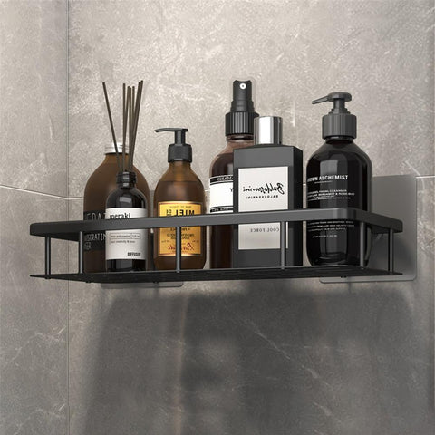 Black bathroom shelf holding toiletries above a basin