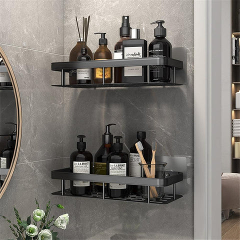 Two-tier black bathroom shelf beside a mirror