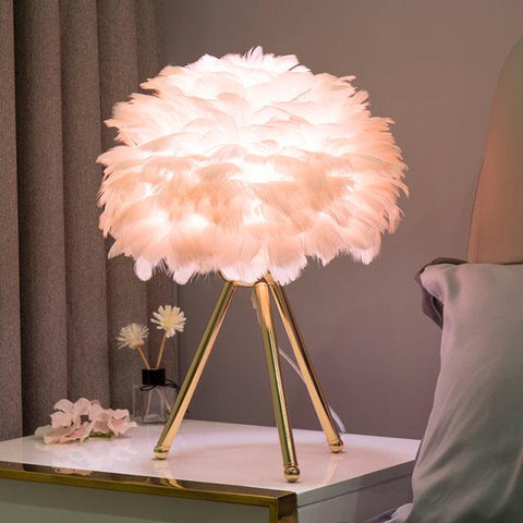 Feather table lamp, light pink shade on a gold tripod base