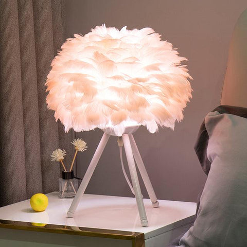 Feather table lamp, light pink shade on a white tripod base