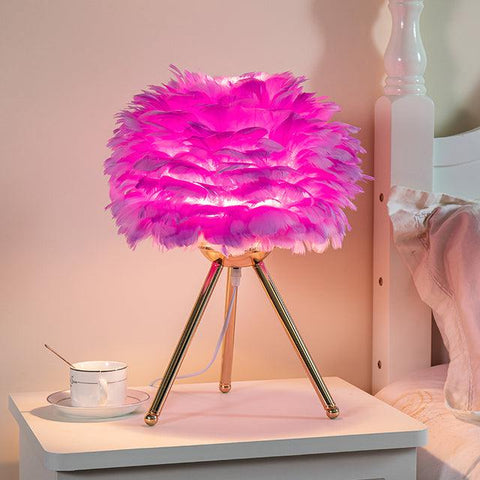 Feather table lamp, pink shade on a gold tripod base