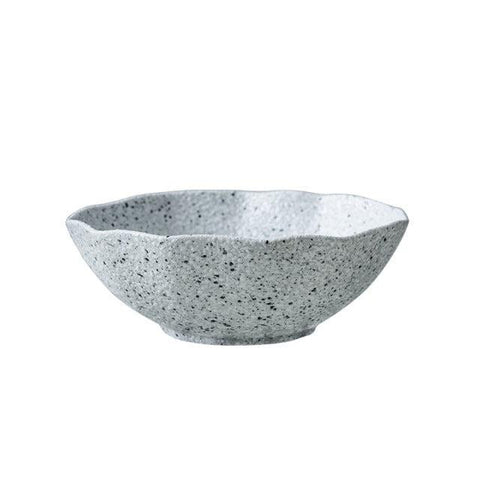 Granite stoneware bowl with an organic rim, seen from the side