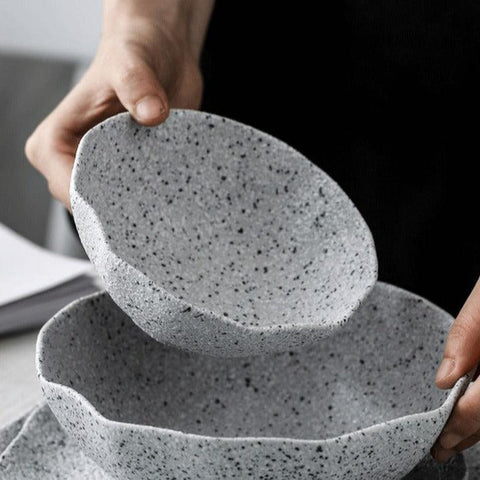 Two speckled granite stoneware bowls held side by side