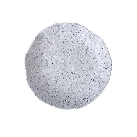 Granite stoneware plate with a raw, uneven edge