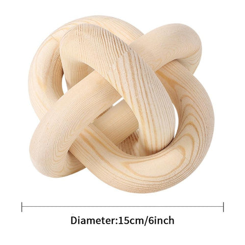 Knotted chain sculpture in natural wood tone, 15cm across
