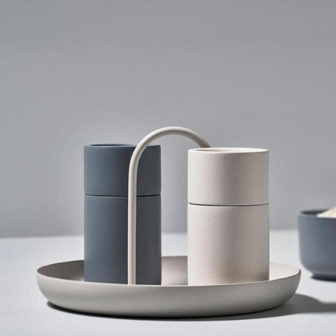 Warm grey Loop accessory tray with storage canisters on a worktop