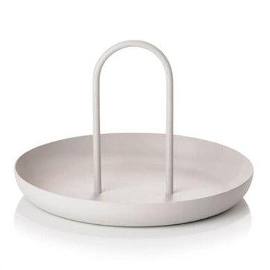 Loop accessory tray in warm grey, round metal tray with an arched handle