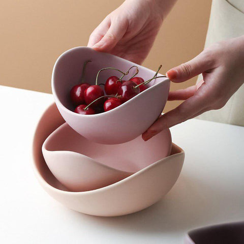 Rose lotus bowl holding berries