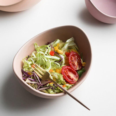 Lotus bowl holding a salad