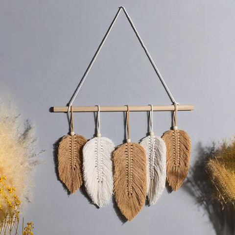 Macrame leaf wall hanging on a wooden dowel