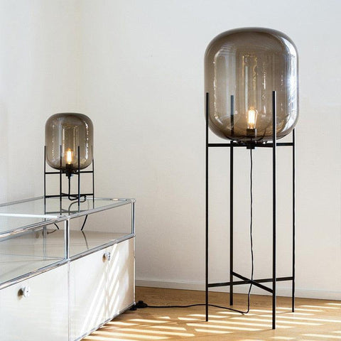 Two Nordic Glow floor lamps beside a console in a living room