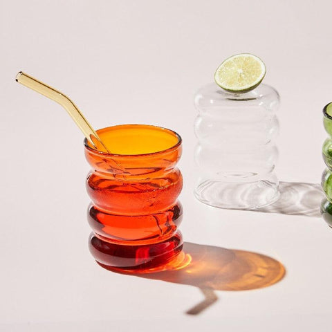 Retro ribbed glass tumblers with lime and a gold straw