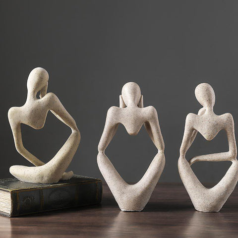 The three stone Thinker sculpture poses shown side by side